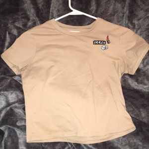 Nude shirt with cute sew ons !offers available